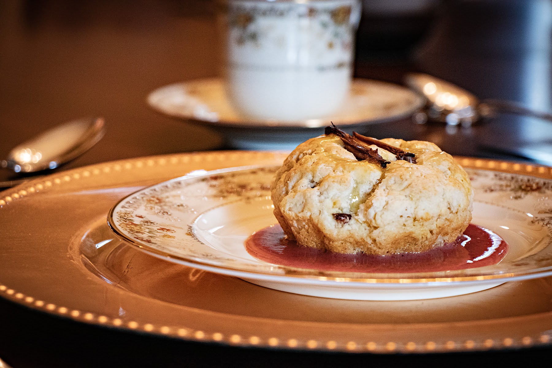 Fourth course — house-made date biscuit with berry coulis