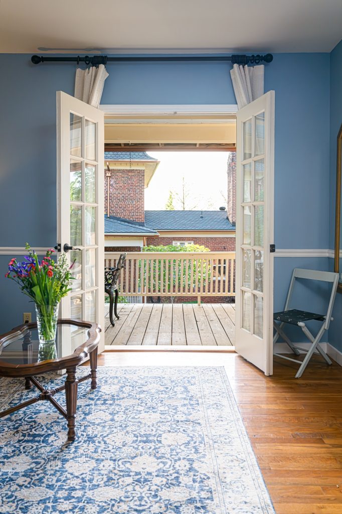 Blue Hydrangea suite — French doors open to private balcony with mountain view at The Reynolds Mansion