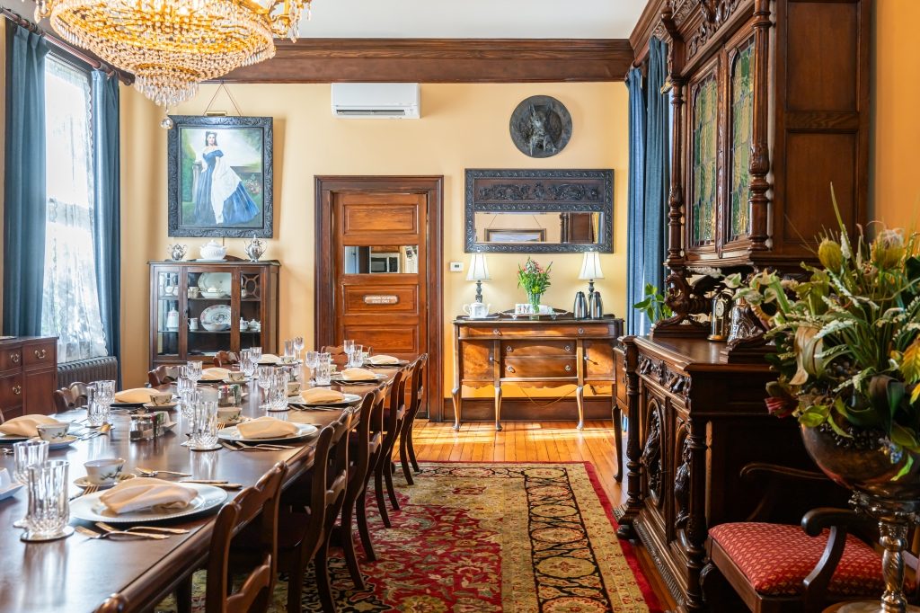 Period portrait above the antique buffet in the grand dining room at The Reynolds Mansion