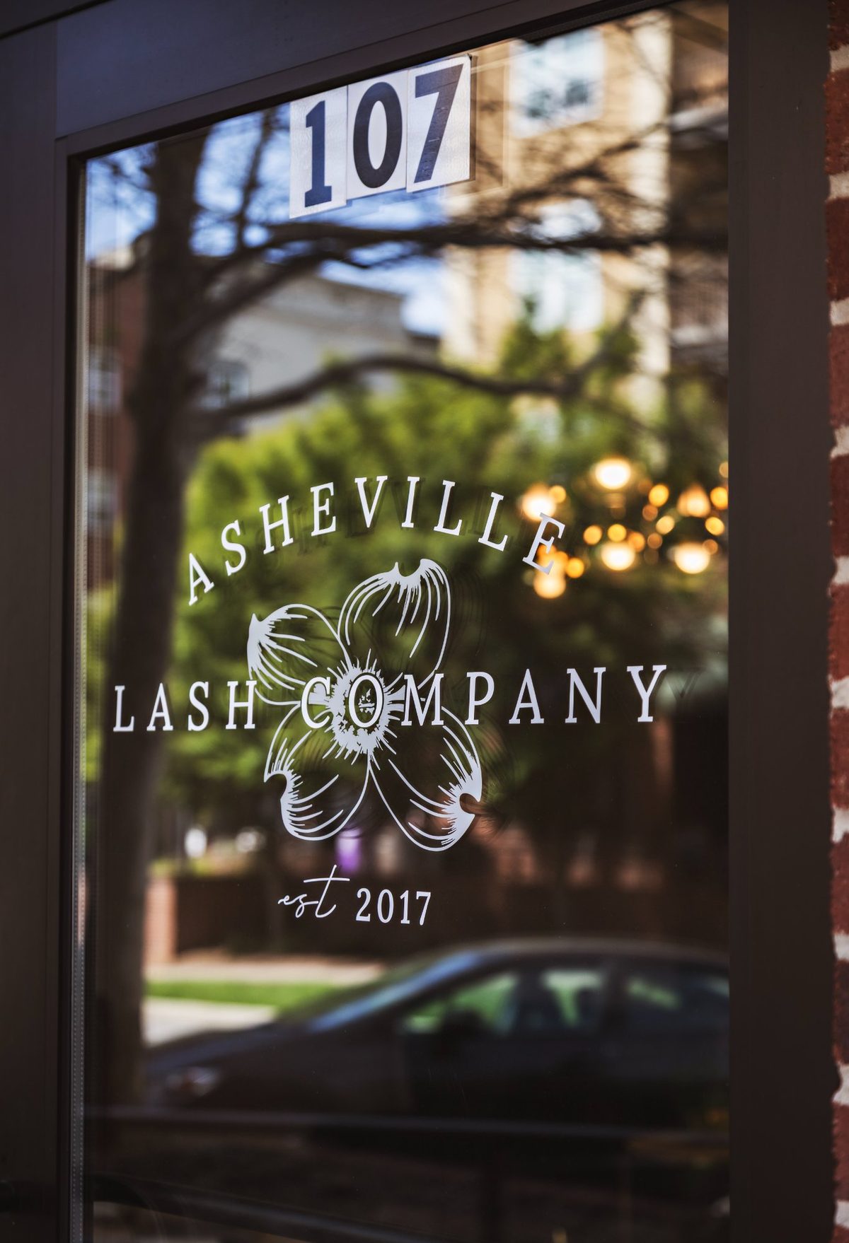 Asheville Lash Company door in Reynolds Village — established 2017, suite 107