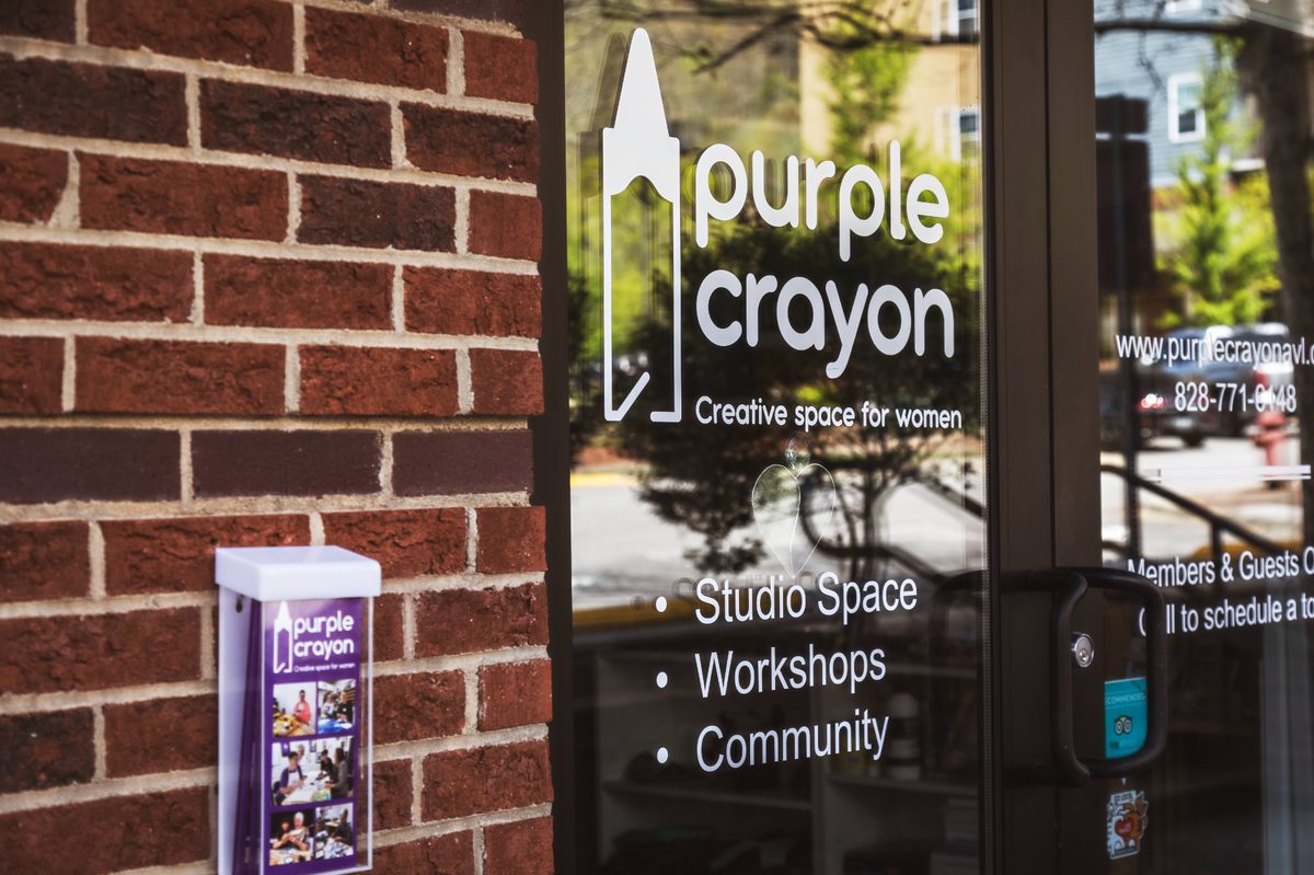 Purple Crayon storefront in Reynolds Village — creative space for women offering studio space, workshops, and community