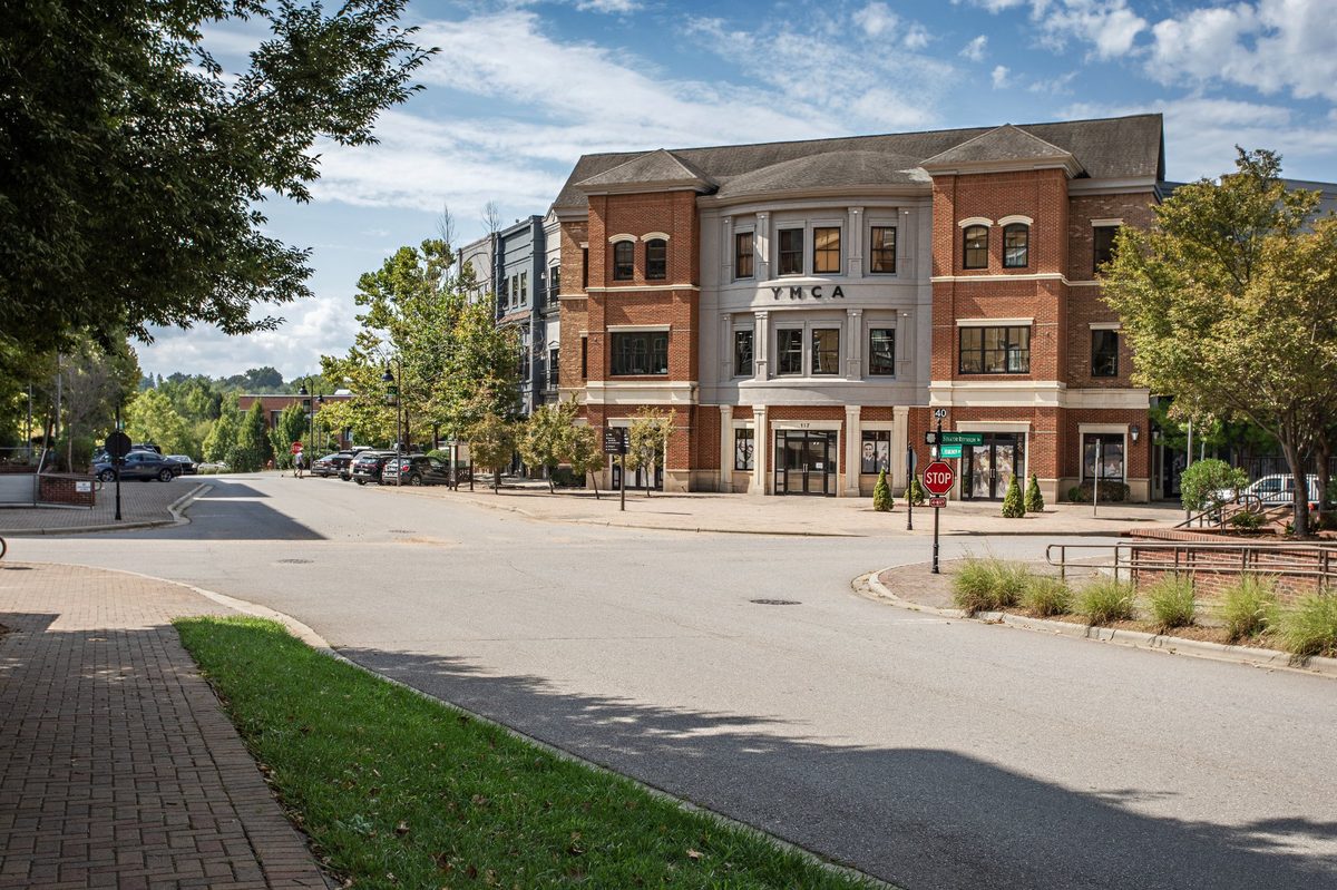 Woodfin YMCA building in Reynolds Village — brick and stone facade with YMCA lettering